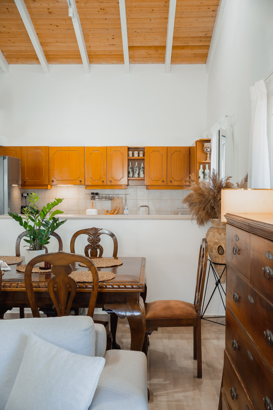 Wooden dining table and kitchen